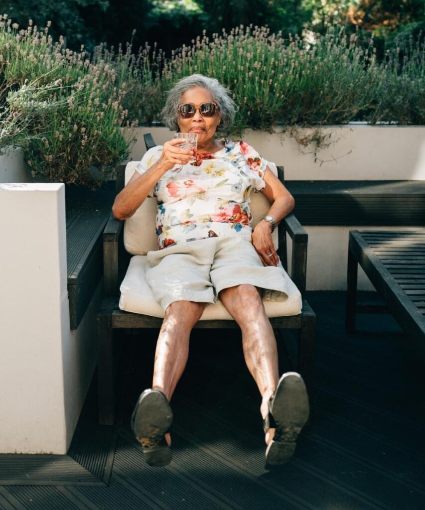 Woman sitting outside enjoying a drink